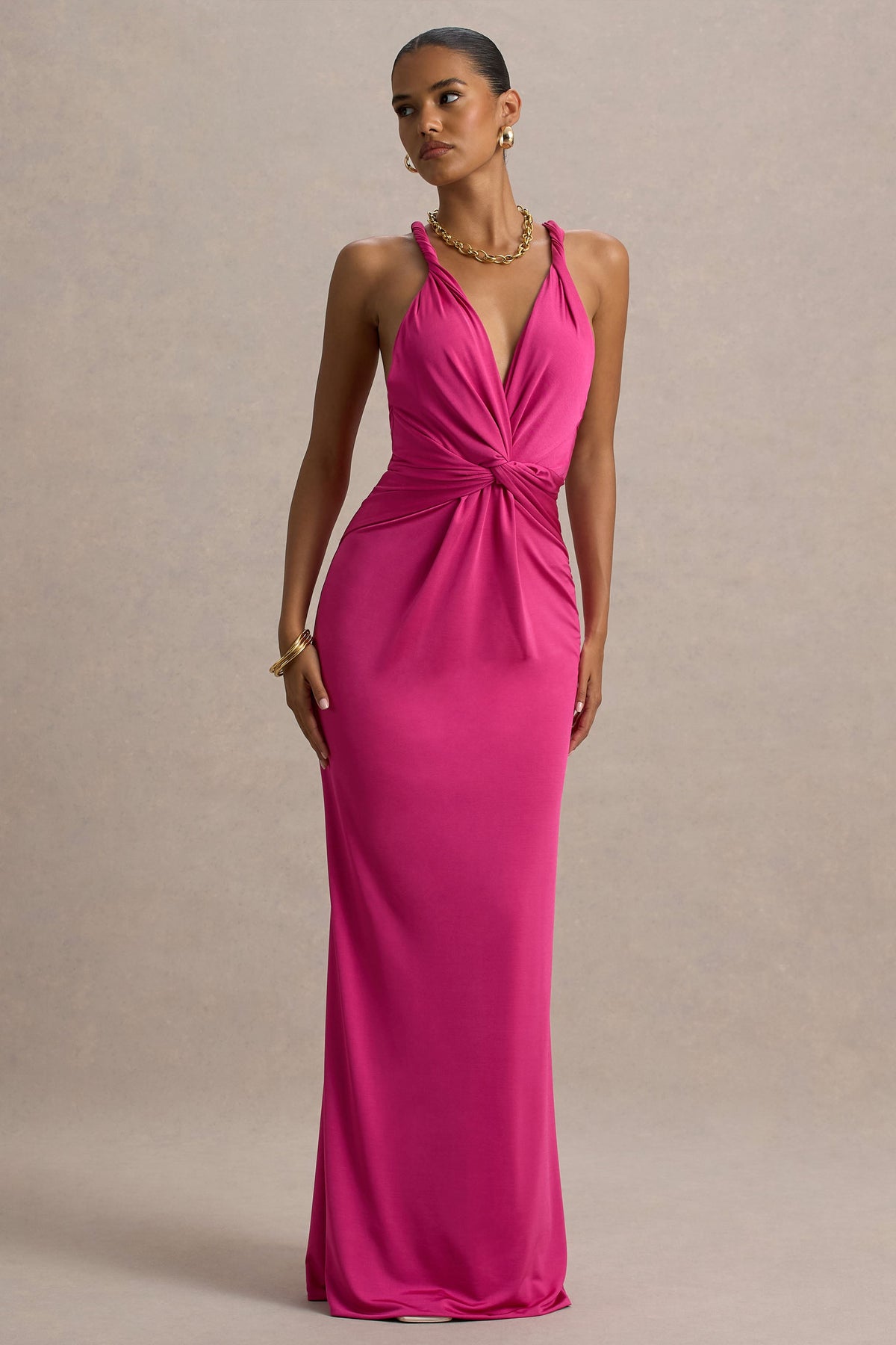 Santez | Heißes pinkfarbenes Maxikleid mit verdrehtem Plunge-Ausschnitt.