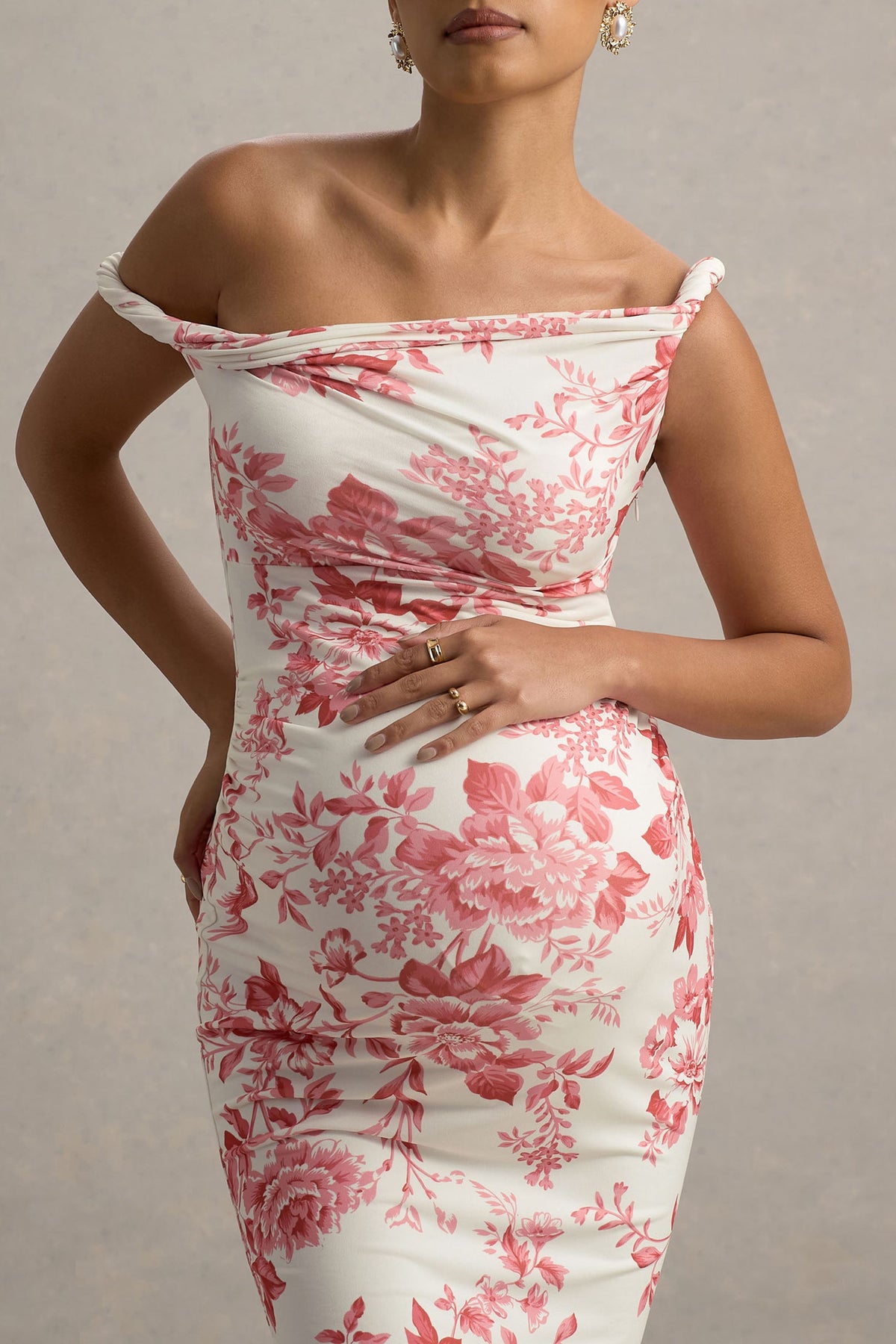 Salome | Rosa Midikleid mit Blumenmuster, gedrehter asymmetrischer Umstandsschnitt