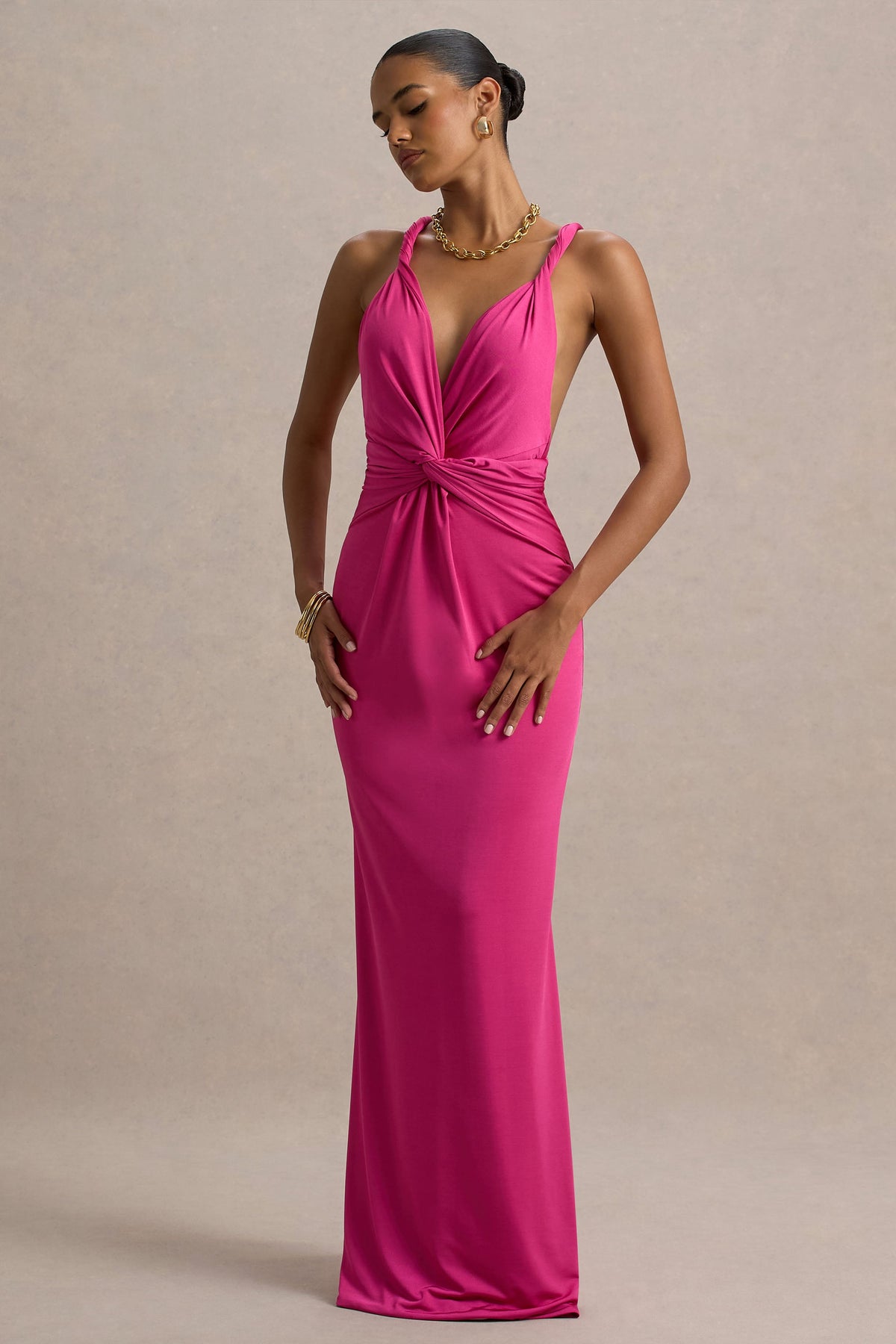 Santez | Heißes pinkfarbenes Maxikleid mit verdrehtem Plunge-Ausschnitt.