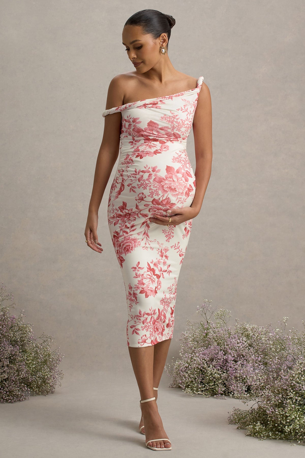 Salome | Rosa Midikleid mit Blumenmuster, gedrehter asymmetrischer Umstandsschnitt